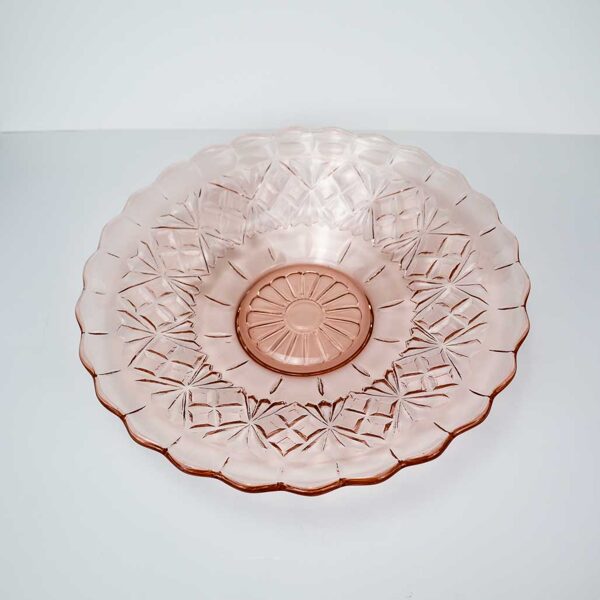 Liels rozā stikla trauks